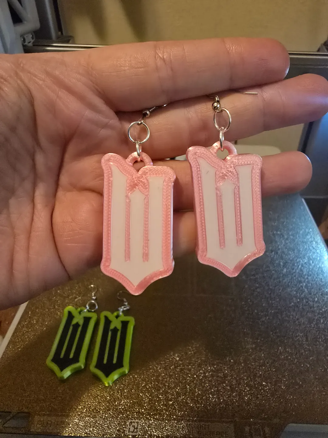 Wicked Logo earrings Elphaba Glenda view 3
