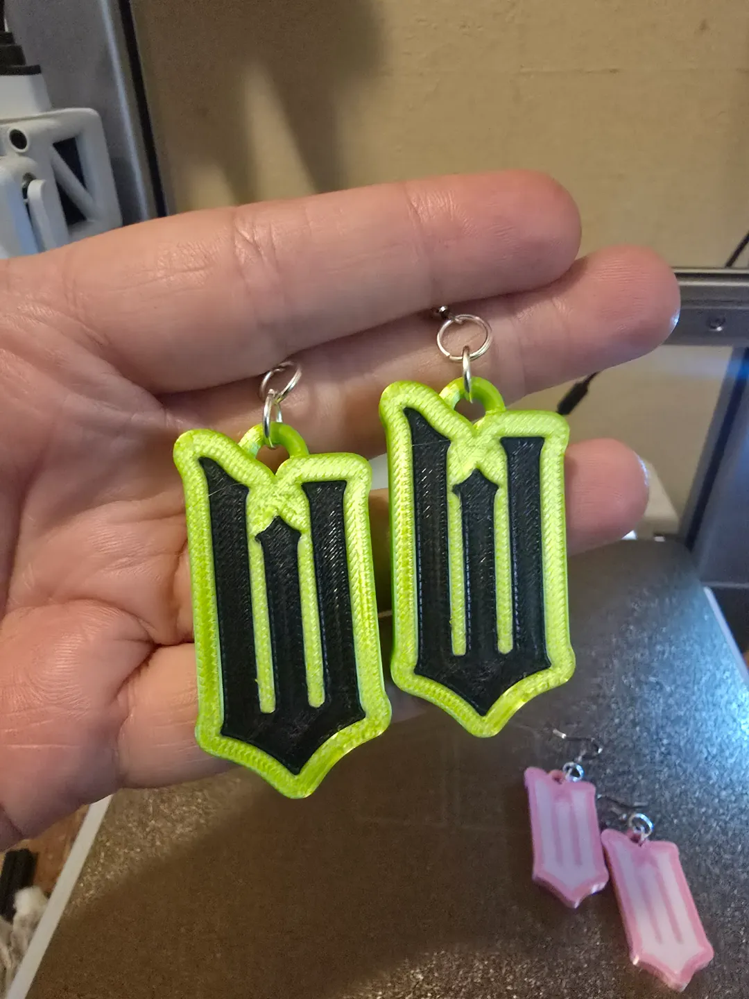 Wicked Logo earrings Elphaba Glenda view 2