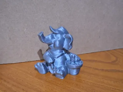 Gardener Elephant Figurine