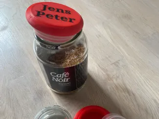 Cafe Noir jar lid with text