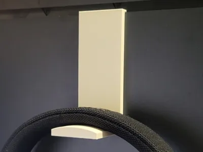 Headphone holder to hang on printer.