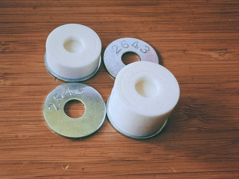 Stacking game pieces that fit in washers