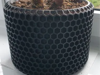 Solid plant pot with hex pattern