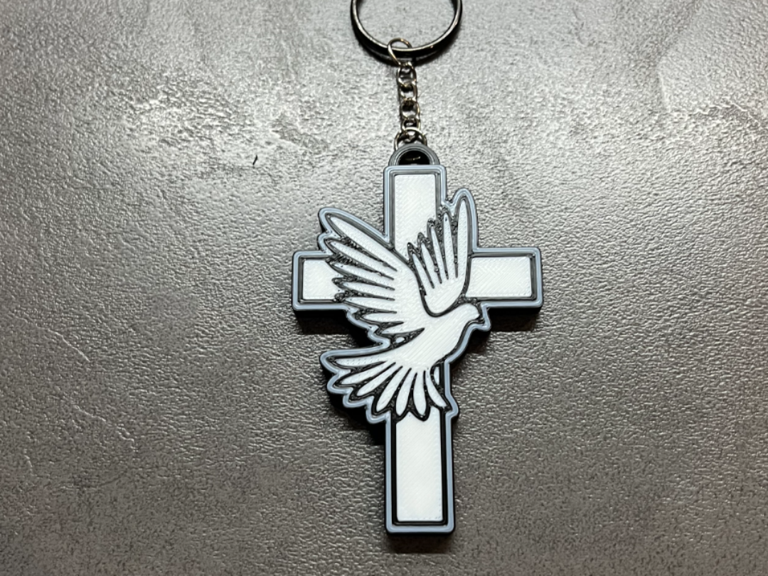 keychain combines the Cross and the Dove