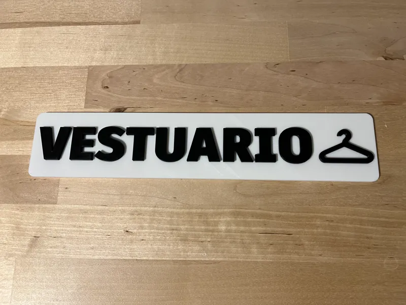 Cartel “Vestuario” con icono de percha