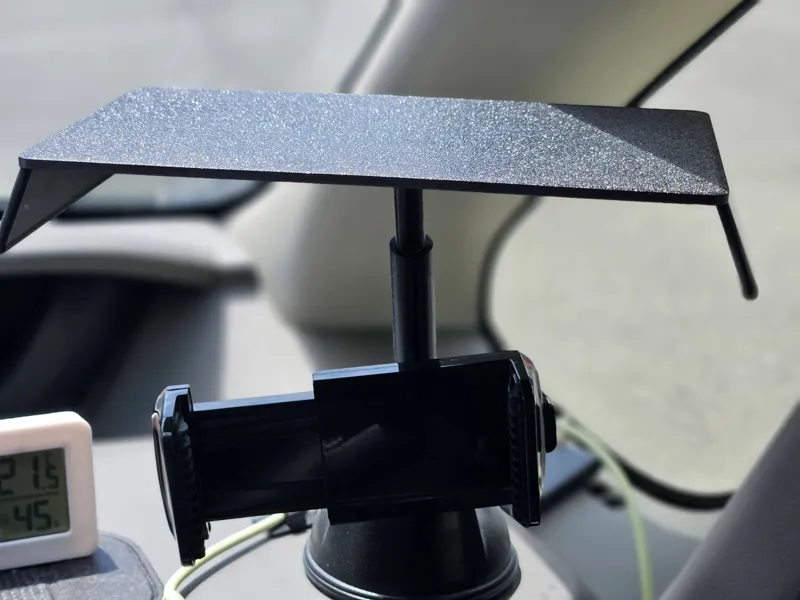 Smartphone sun shade for car dashboard