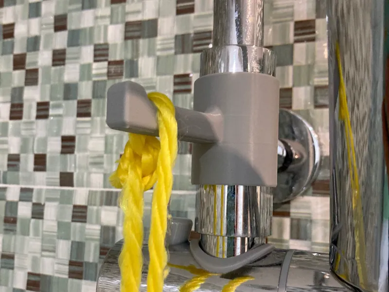 Colgador para barra de ducha