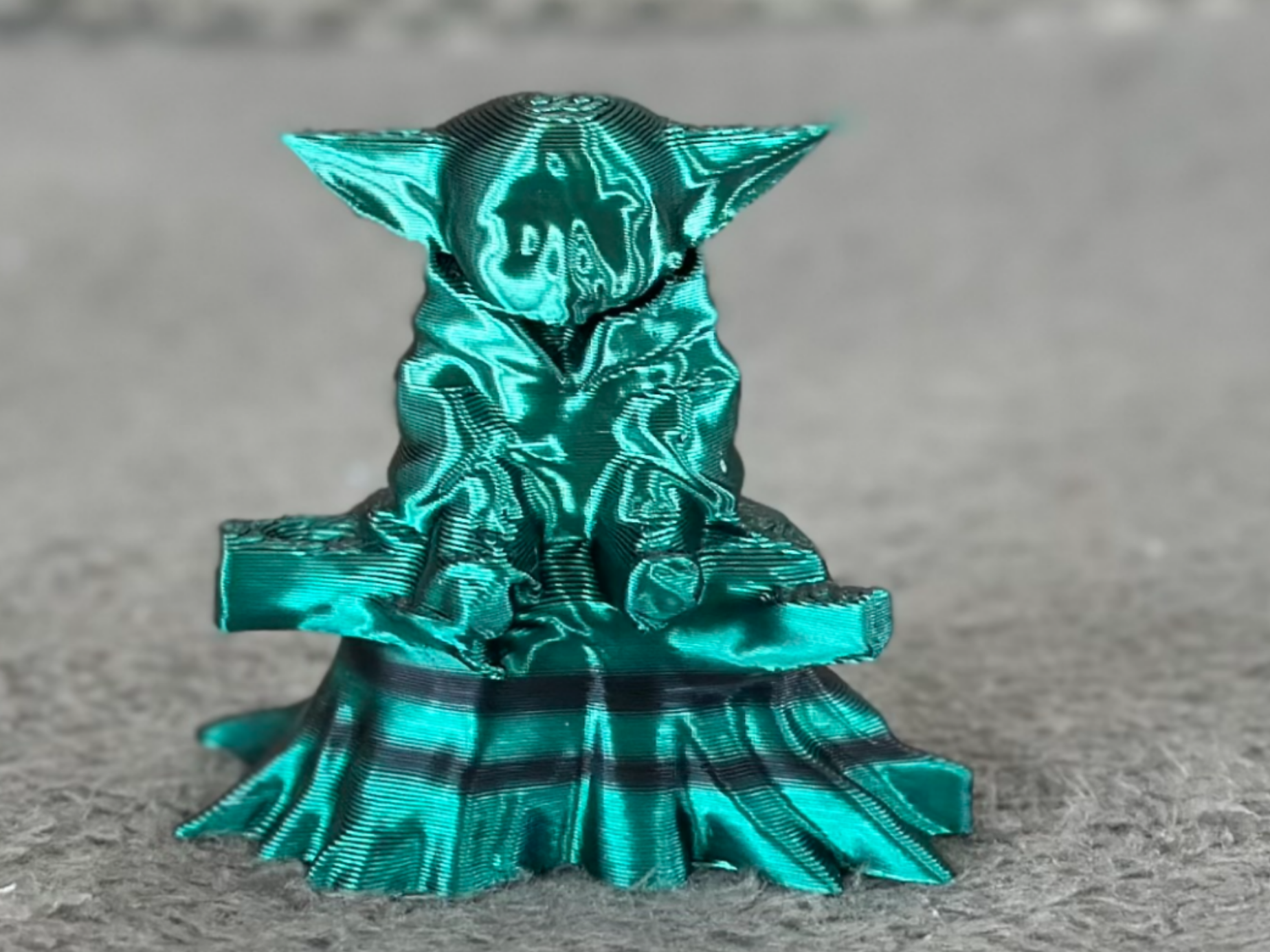 Cute sitting baby Yoda