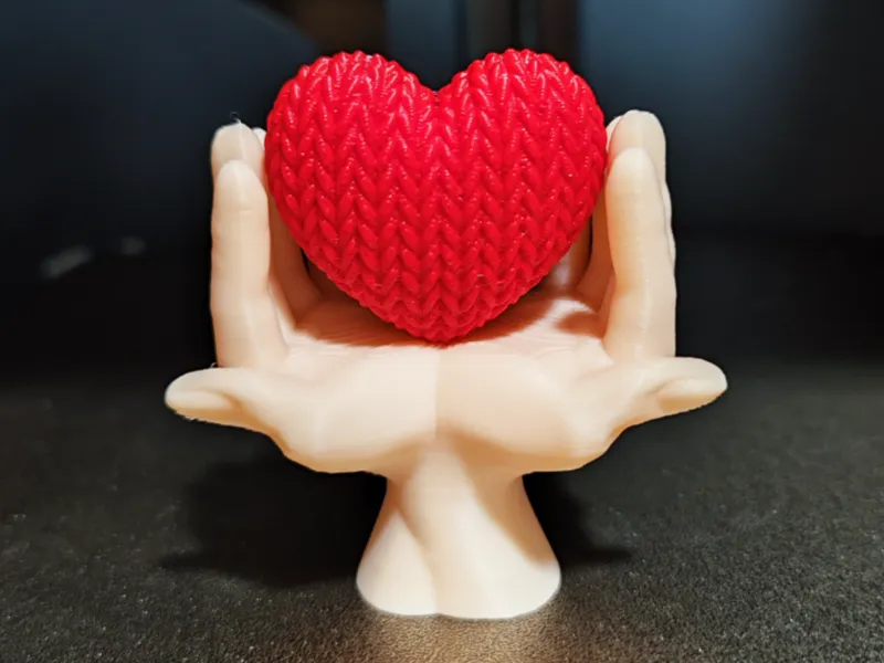 Heart knitted in hands