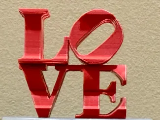 Robert Indiana's LOVE AMOR dual angle sculpture