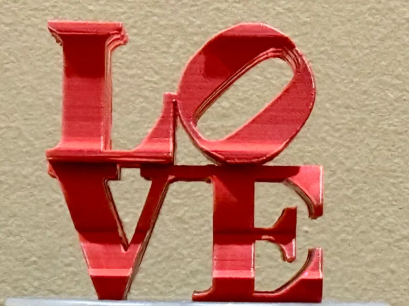 Robert Indiana's LOVE AMOR dual angle sculpture