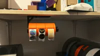 Holder for up to three tape rolls