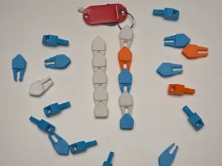 Retractable modular keychain fidget