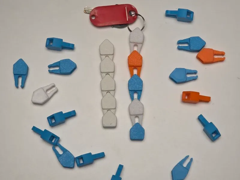 Retractable modular keychain fidget