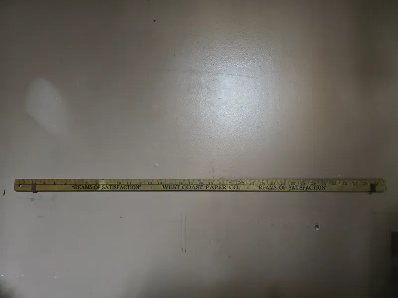 Wall mount display for yardstick or ruler