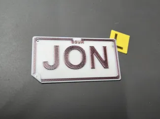Customisable license plate name tag