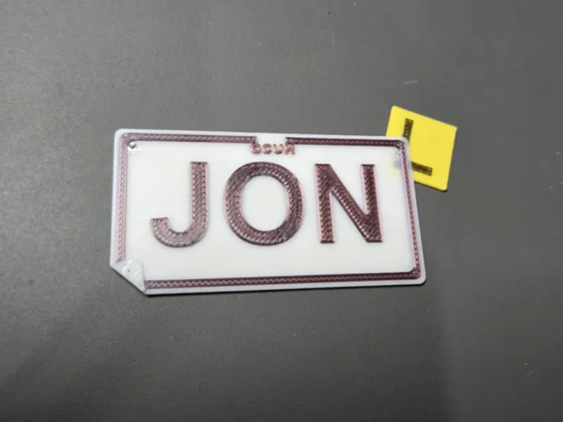 Customisable license plate name tag