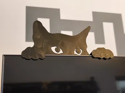 Spying cat  - on the monitor edge