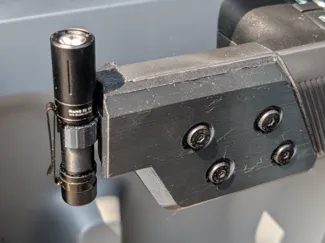 Ford Maverick clip flashlight holder drivers side.
