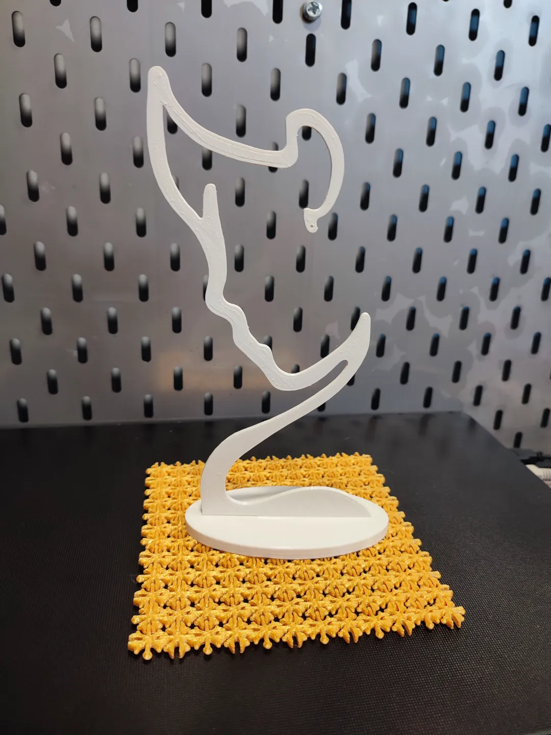Earring display/holder stand. Face silhouette view 3