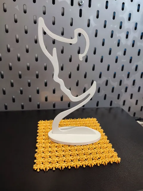 Earring display/holder stand. Face silhouette view 3