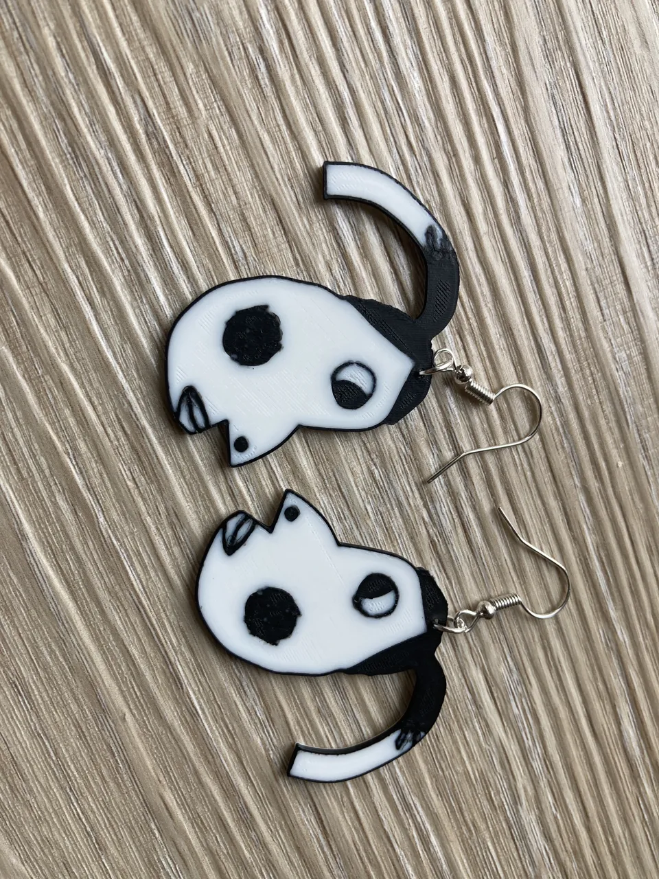Hyperpigmentetion earrings / keychain meme view 4