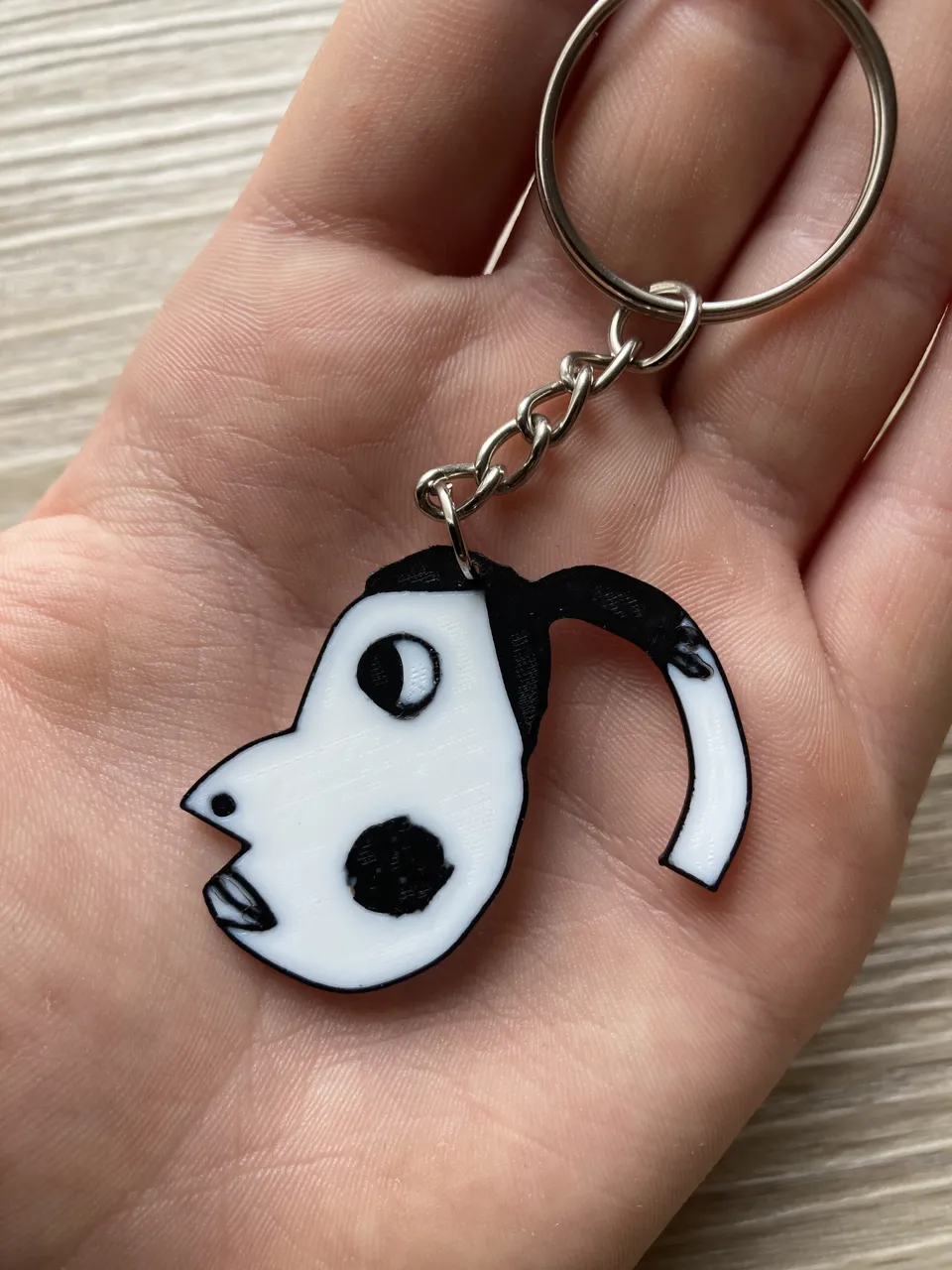 Hyperpigmentetion earrings / keychain meme view 3