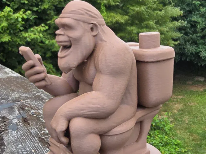 Sasquatch on toilet with phone