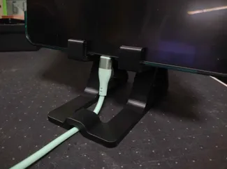 Charging mobile phone/tablet stand