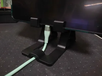 Charging mobile phone/tablet stand