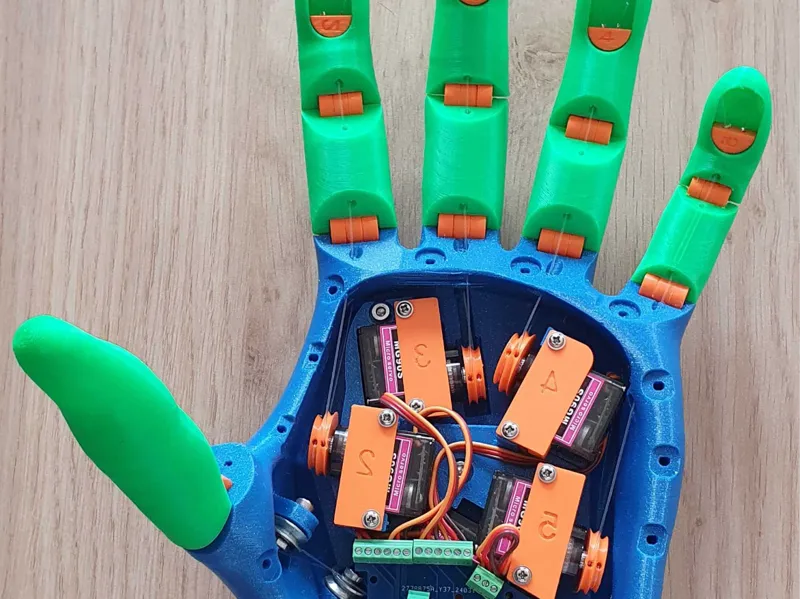 Voice activated low cost motorized hand