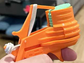 Disc shooter - 12 shot extension and easy-load mag