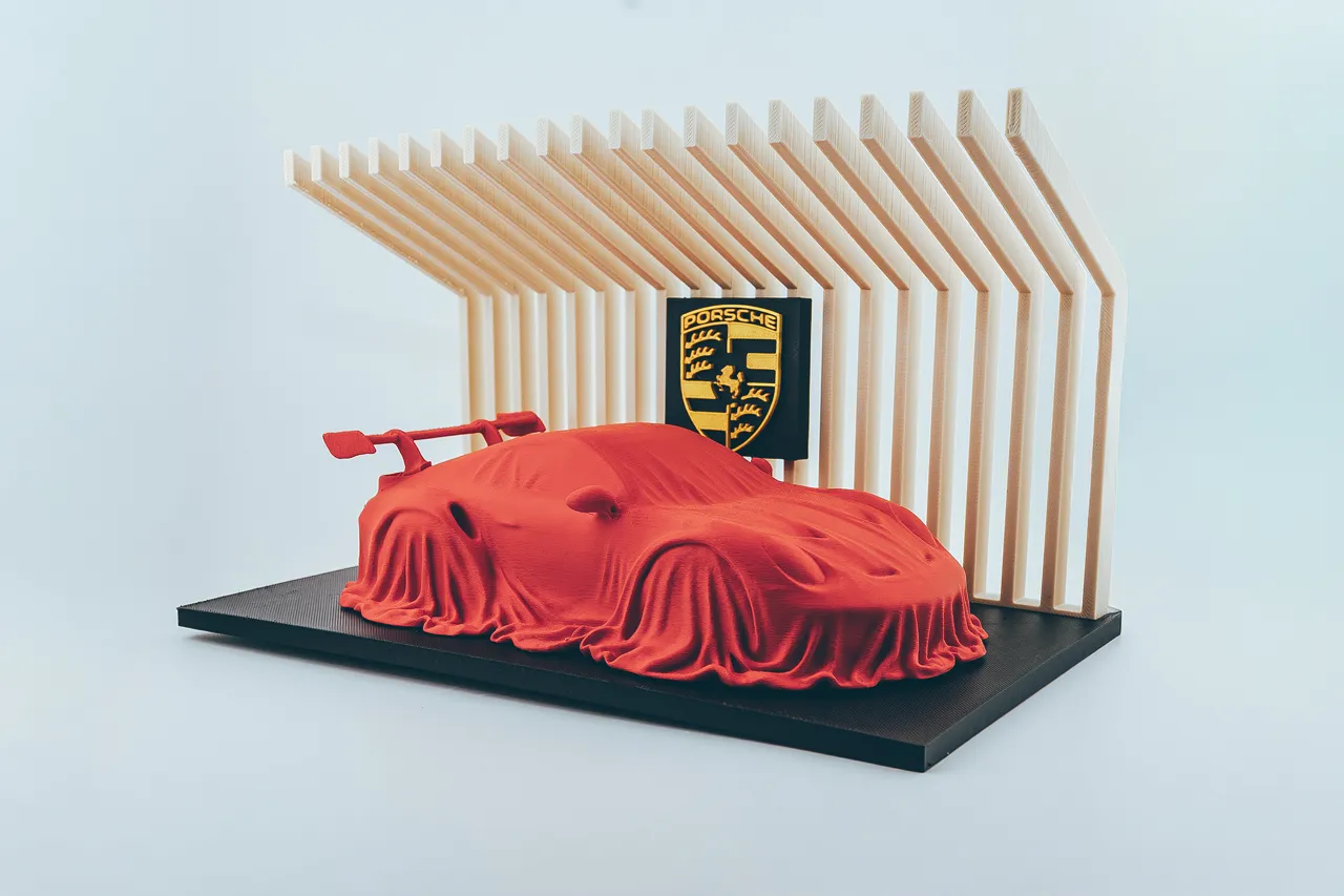 Porsche 911 GT3 RS covered on a diplay stand. view 3