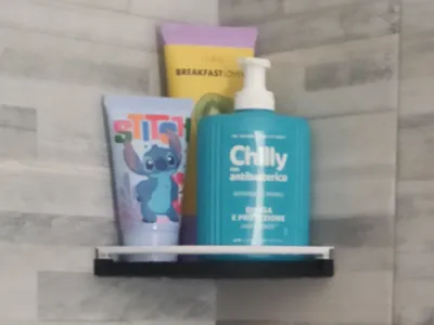 Corner shower shelf