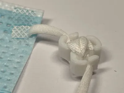 Mask strap length adjustment tool