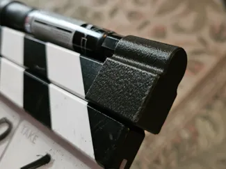 Clapperboard Dry-erase marker clamp