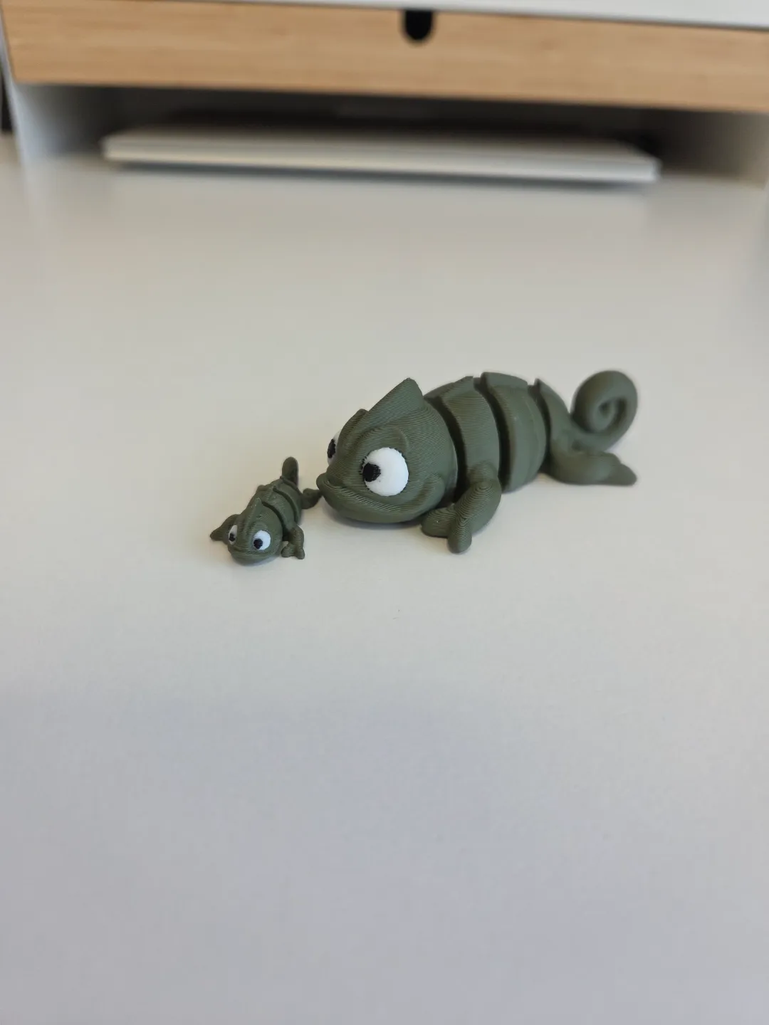 Cute tiny articulated baby Chameleon view 3