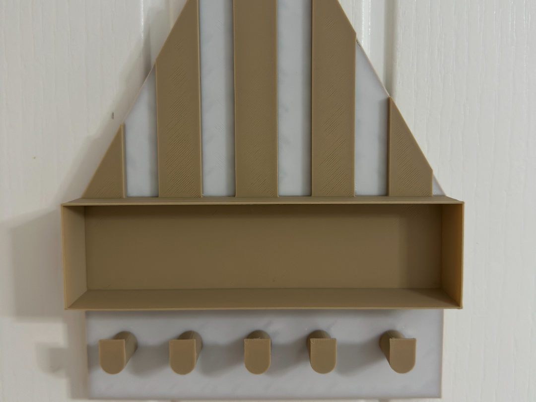 triangular wall key holder with a storage shelf