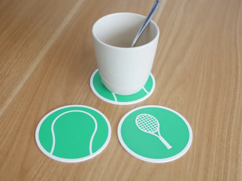 Double sided tennis coaster