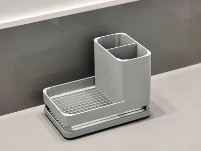 Drip tray with toothbrush/toothpaste holder
