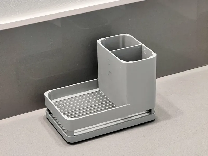 Drip tray with toothbrush/toothpaste holder