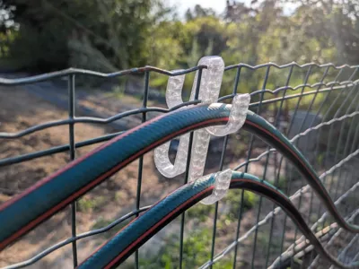 Irrigation Hose Holder for wire Fences