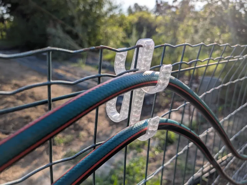 Irrigation Hose Holder for wire Fences