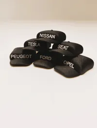 CAp with car brand textured surface
