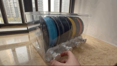 20L sealed enclosure filament spool holder with manual external rewind support