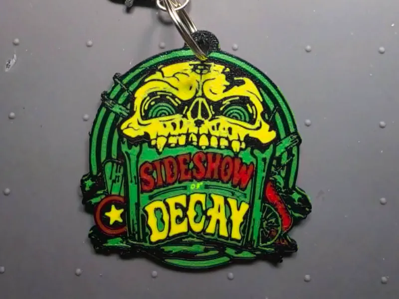HHN 35 2026 Sideshow of Decay Scare Zone Keychain