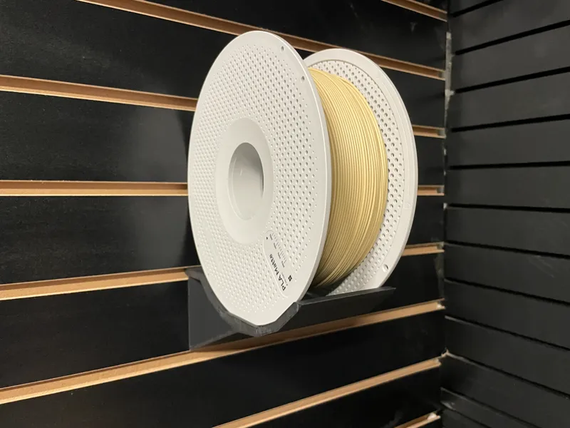 Spool holder for Slat wall