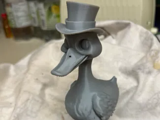 Duck wearing wellington boots and a top hat