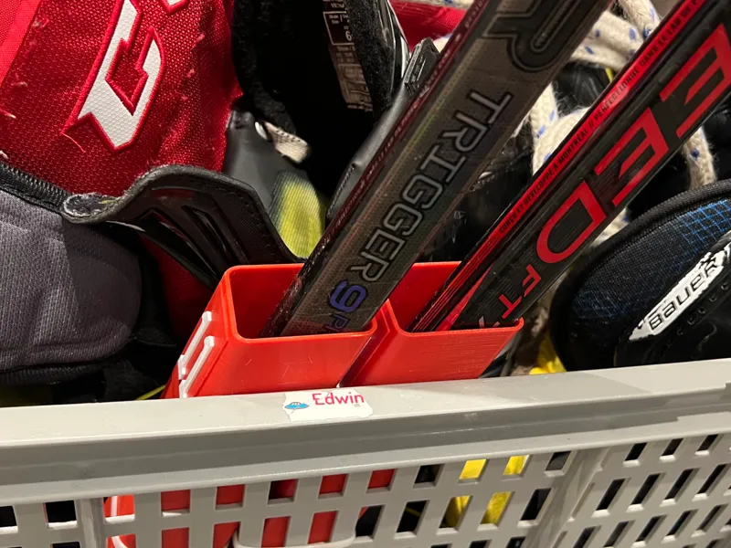 Hockey stick holder for trolley