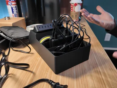 Battery charging station - cord organizer